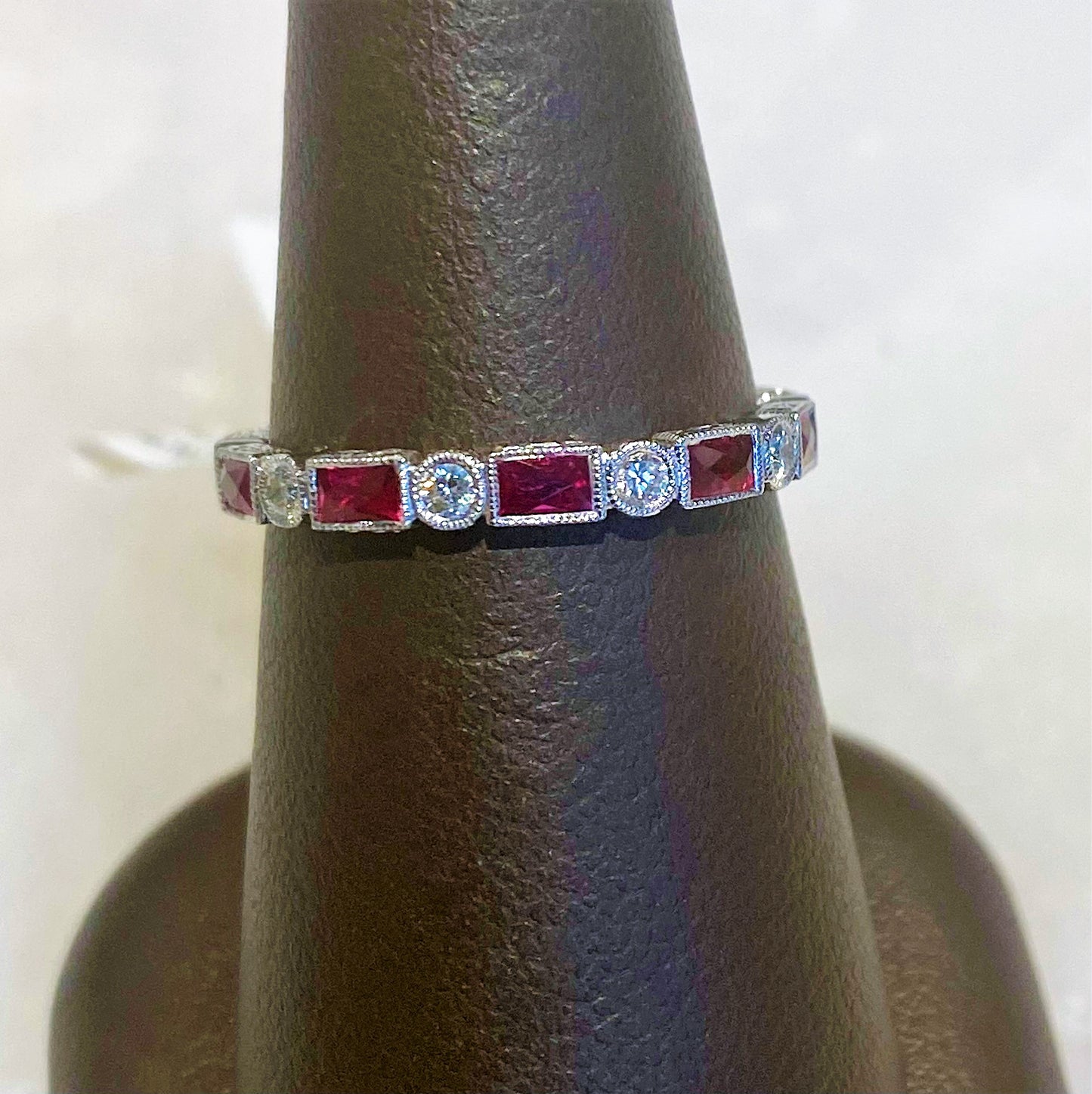 18KW 0.86CTW RUBY, 0.25CTW DIA ETERNITY BAND, SZ 5.75