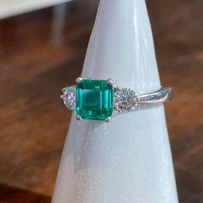 PLATINUM EMERALD AND DIAMOND RING